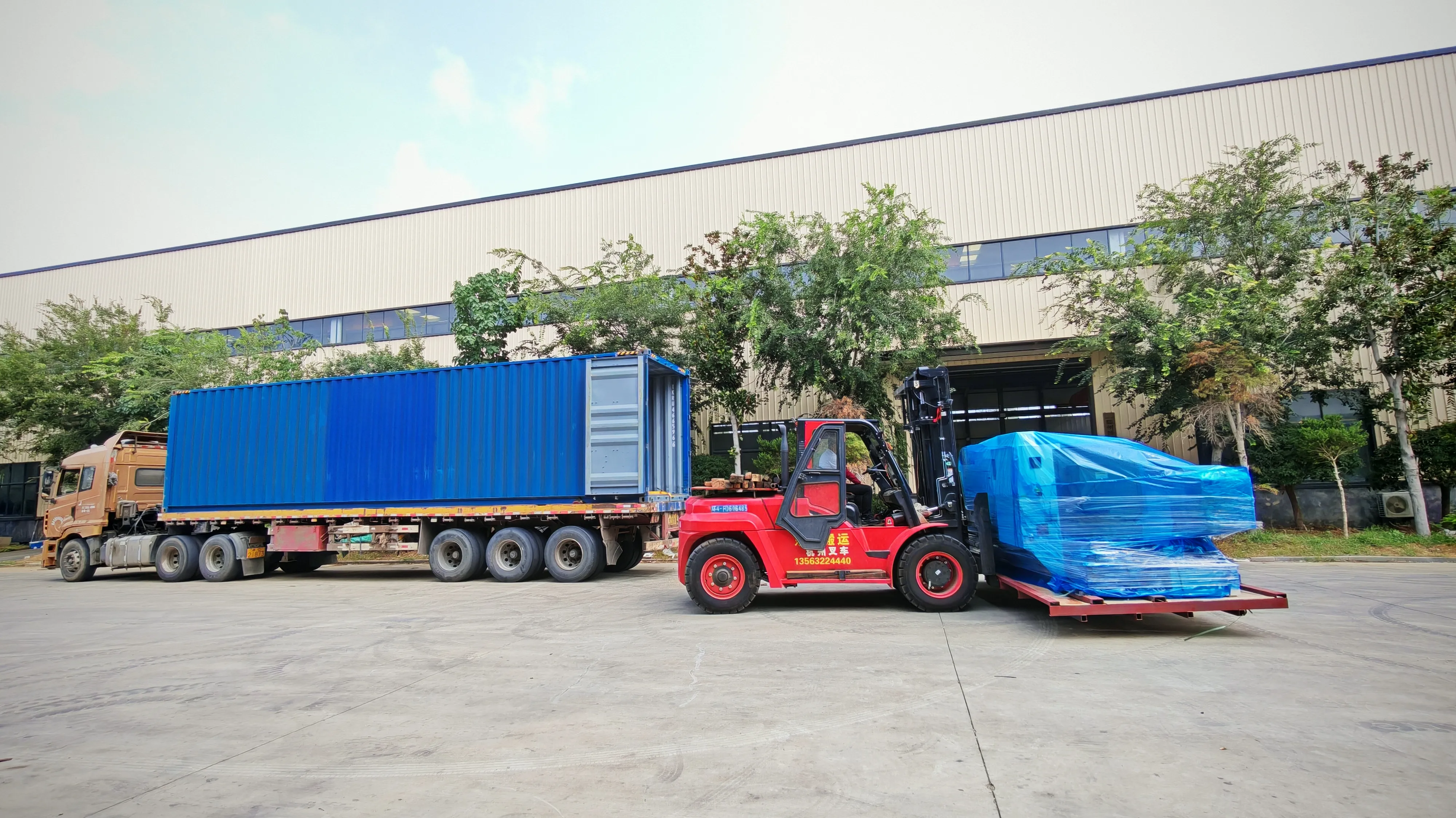 Skymach factory loading bay with 40HQ container truck and heavy forklift